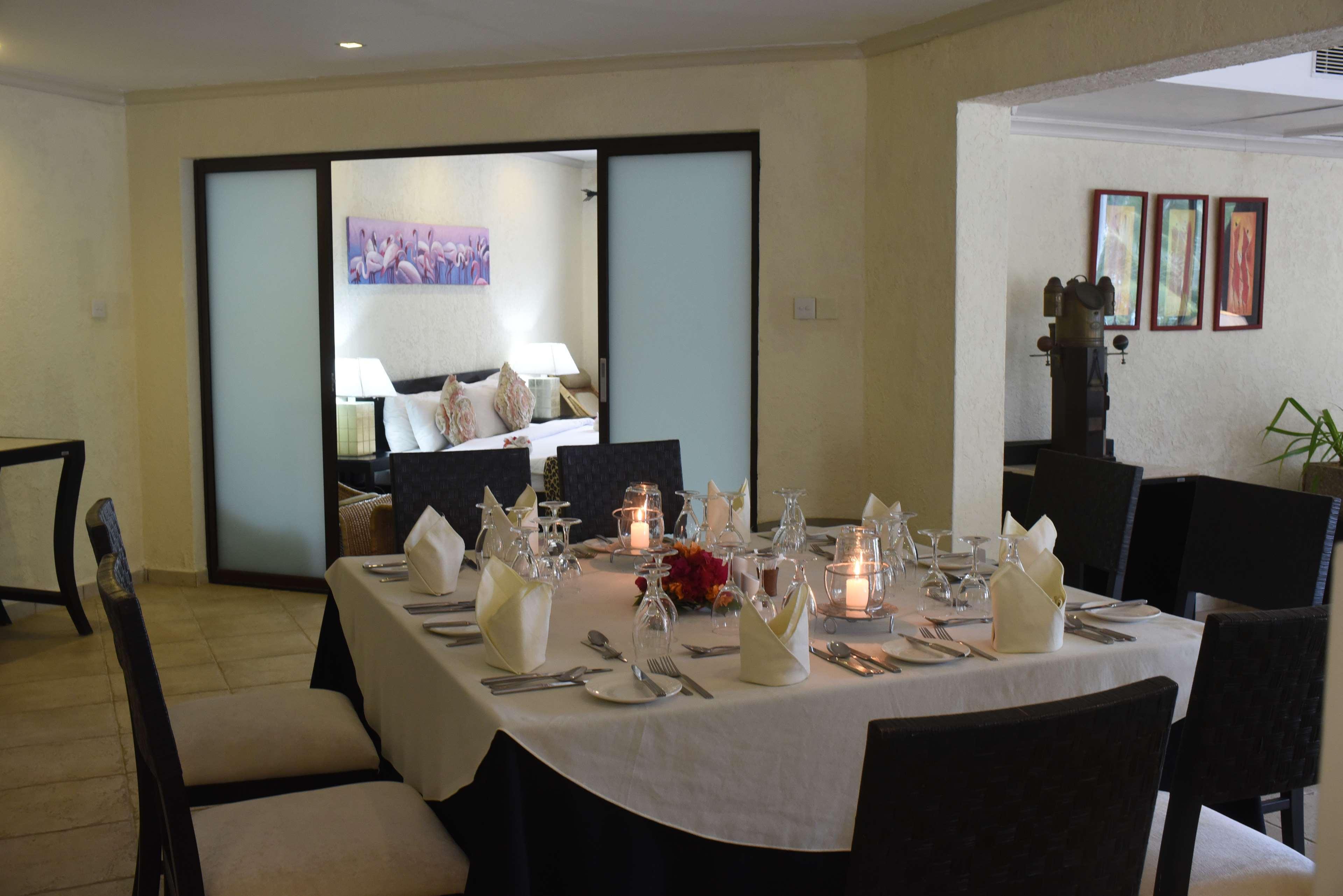 Diani Reef Beach Resort & Spa - Your Beachfront Bliss Awaits Diani Beach Exterior photo A table set for dinner