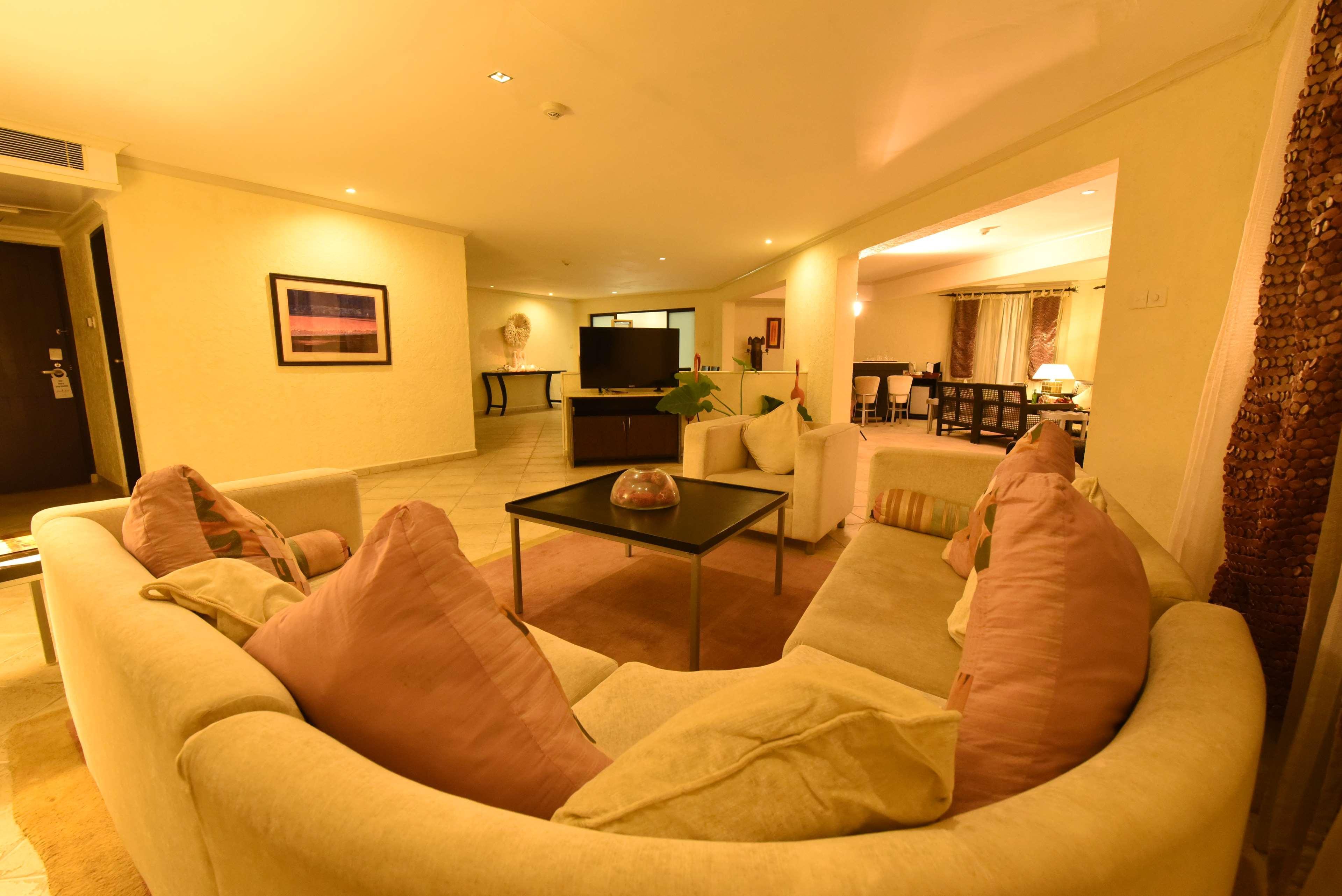 Diani Reef Beach Resort & Spa - Your Beachfront Bliss Awaits Diani Beach Exterior photo A living room in a suite at the Ritz-Carlton, Maldives