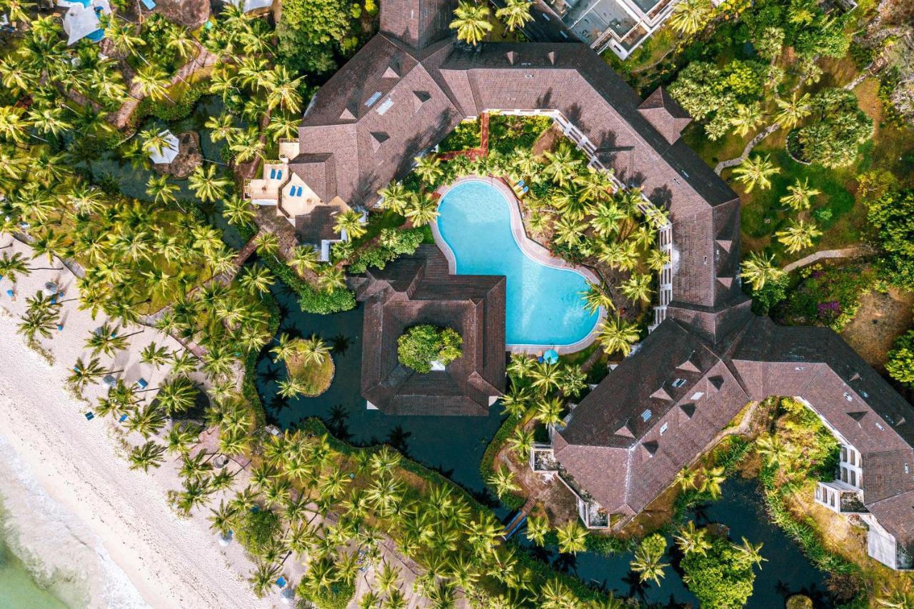 Diani Reef Beach Resort & Spa - Your Beachfront Bliss Awaits Diani Beach Exterior photo Aerial view of the resort