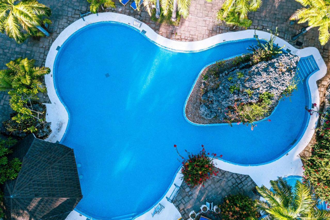 Diani Reef Beach Resort & Spa - Your Beachfront Bliss Awaits Diani Beach Exterior photo Aerial view of a swimming pool
