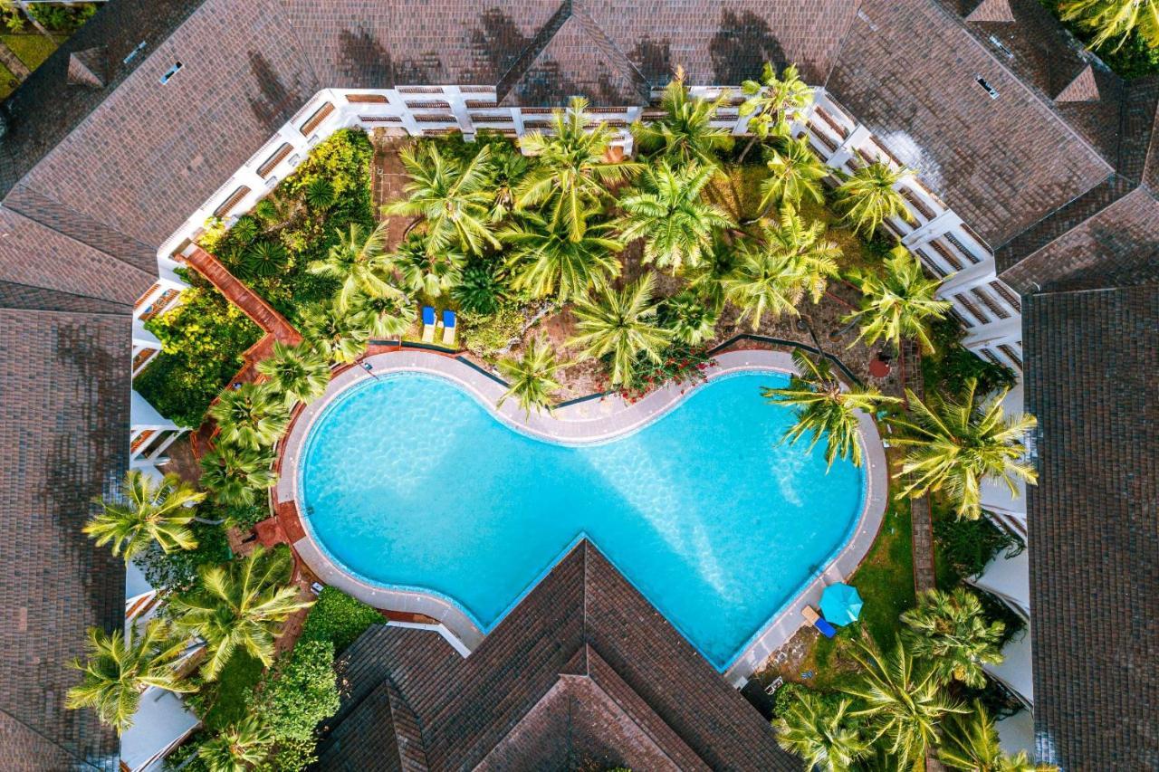 Diani Reef Beach Resort & Spa - Your Beachfront Bliss Awaits Diani Beach Exterior photo Aerial view of the pool at the hotel