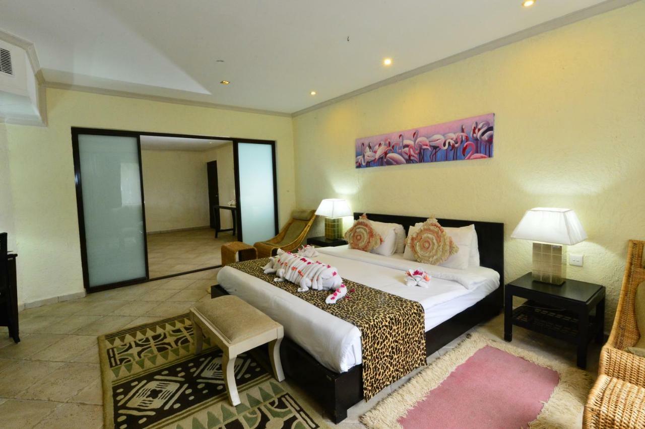 Diani Reef Beach Resort & Spa - Your Beachfront Bliss Awaits Diani Beach Exterior photo A bedroom at the resort