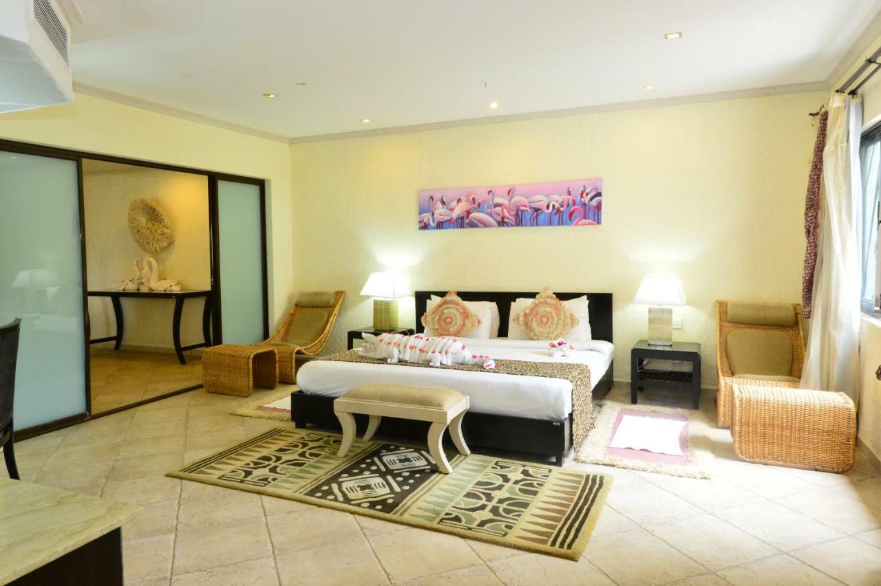 Diani Reef Beach Resort & Spa - Your Beachfront Bliss Awaits Diani Beach Exterior photo A bedroom at the hotel