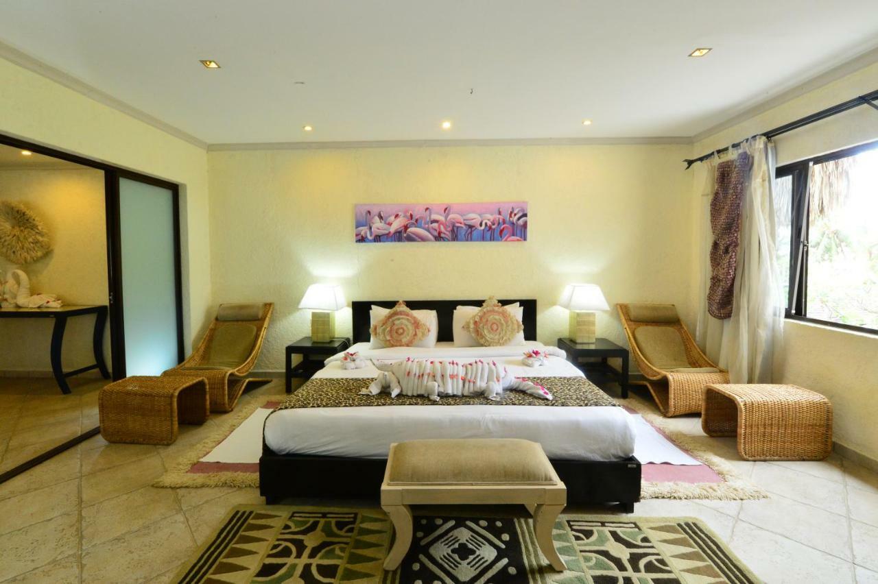Diani Reef Beach Resort & Spa - Your Beachfront Bliss Awaits Diani Beach Exterior photo A bedroom at the resort