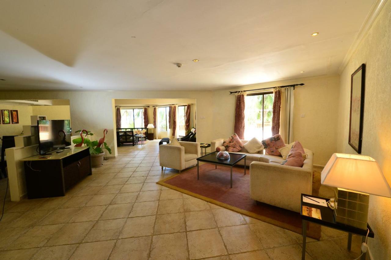 Diani Reef Beach Resort & Spa - Your Beachfront Bliss Awaits Diani Beach Exterior photo A living room in a typical condominium