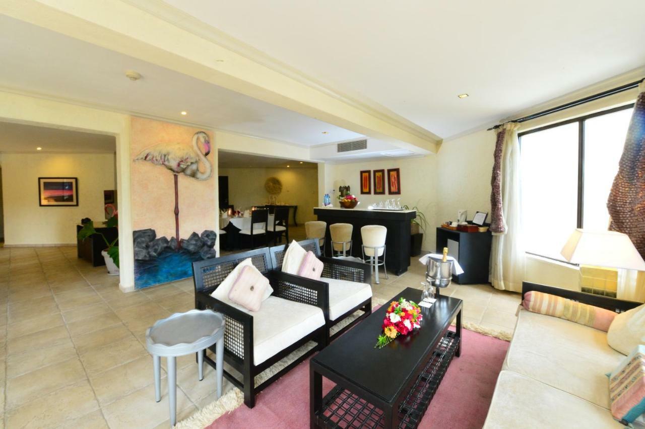 Diani Reef Beach Resort & Spa - Your Beachfront Bliss Awaits Diani Beach Exterior photo A living room in a condominium