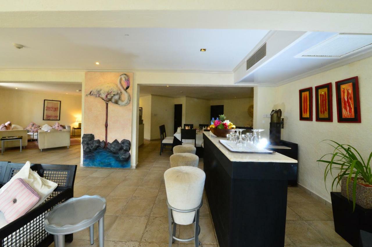 Diani Reef Beach Resort & Spa - Your Beachfront Bliss Awaits Diani Beach Exterior photo The interior of a suite at the hotel