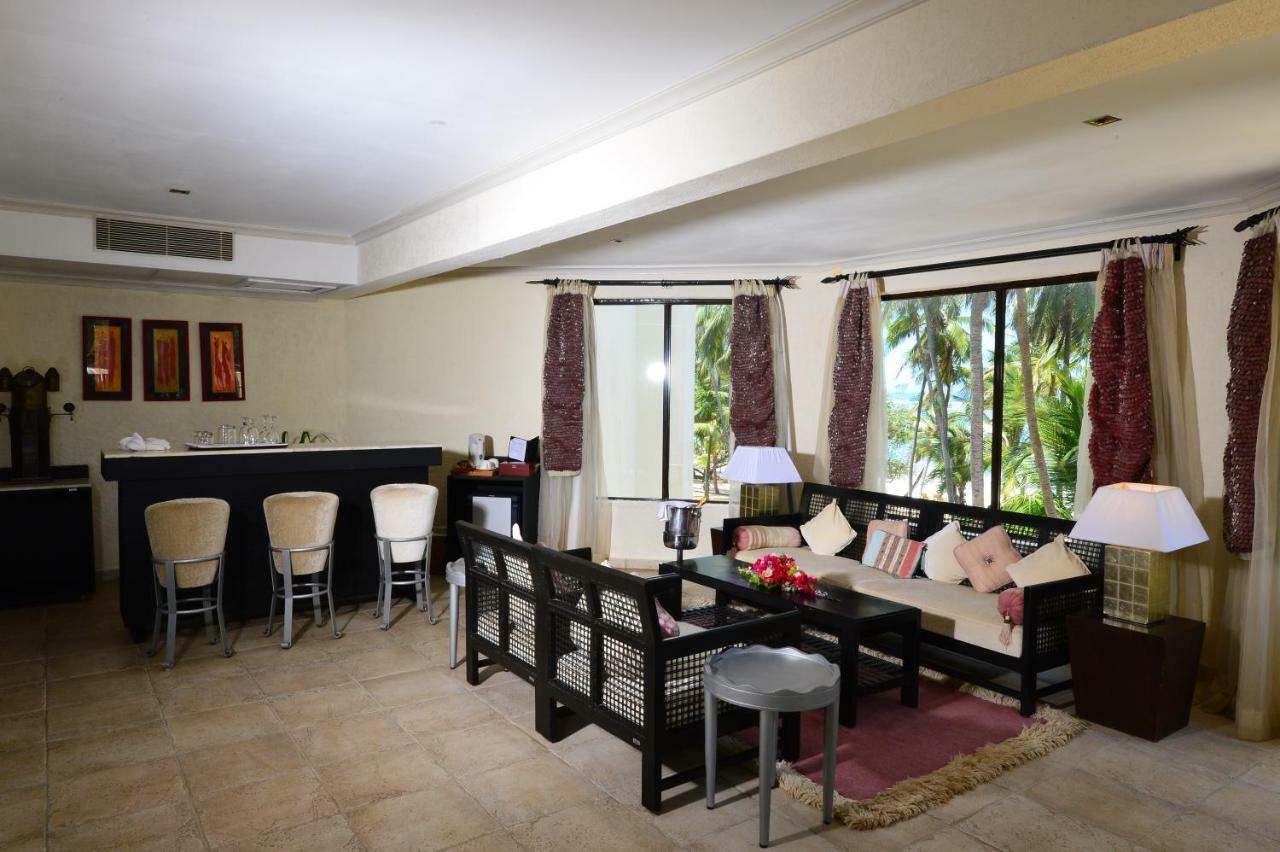Diani Reef Beach Resort & Spa - Your Beachfront Bliss Awaits Diani Beach Exterior photo A living room in a suite at the Hilton San Diego Bayfront
